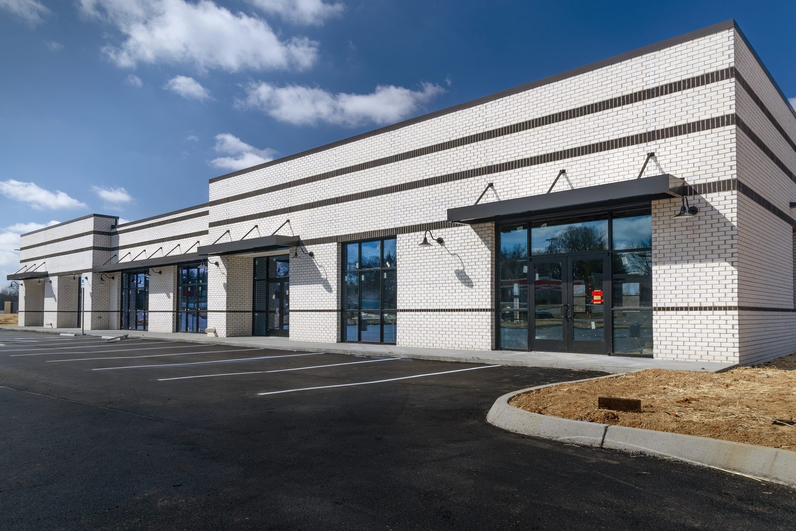 Parking Lot Surfacing by Sand Stone Paving